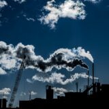 Silhouette of a factory and the smoke it's emitting